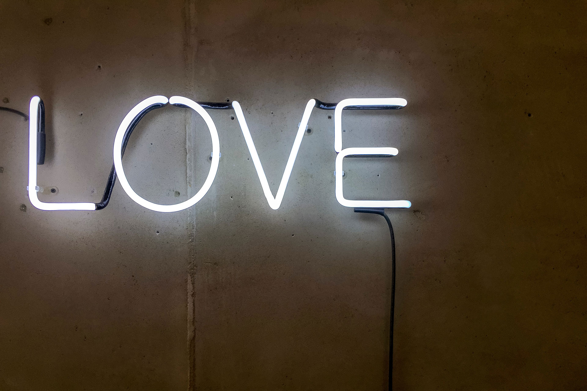 Love neon sign Photo by Etienne Girardet